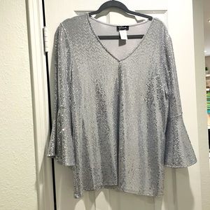 Grey sequined bell sleeve blouse.  V neck, smoke free home.  Never worn, cleaned